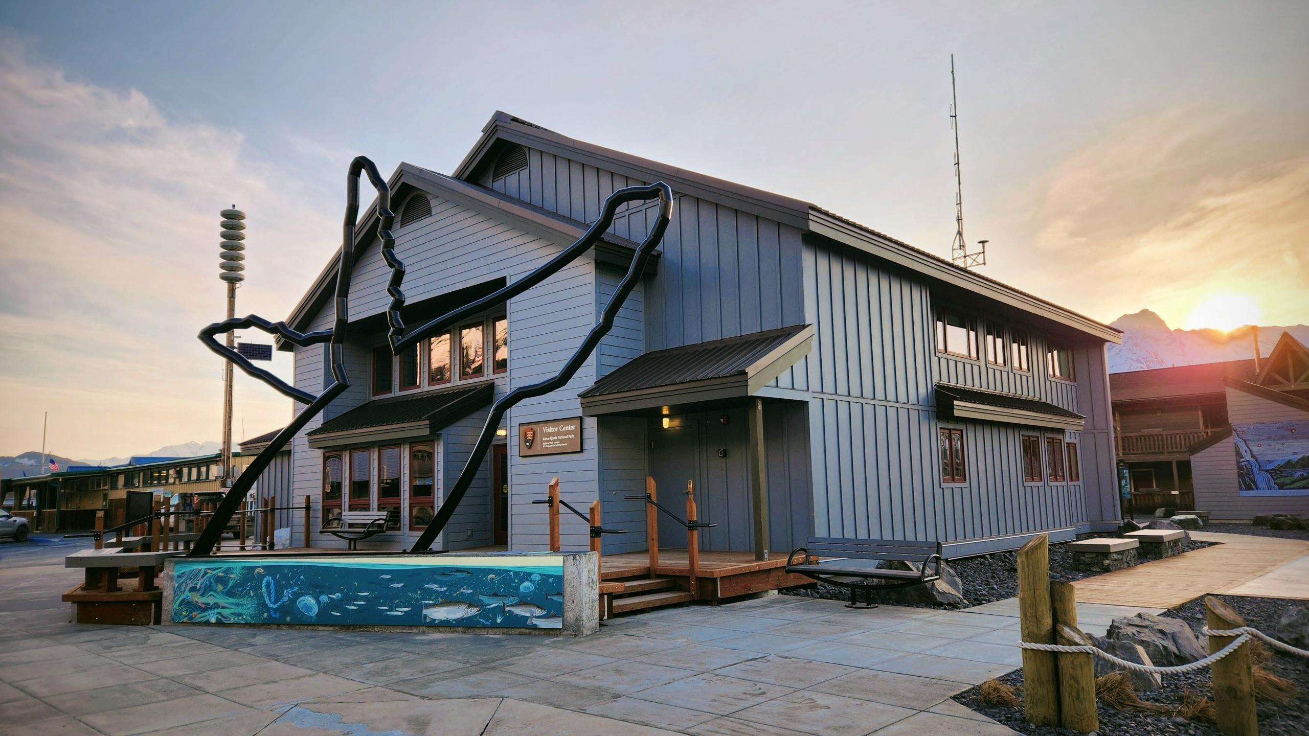 A building with whale sculpture in front