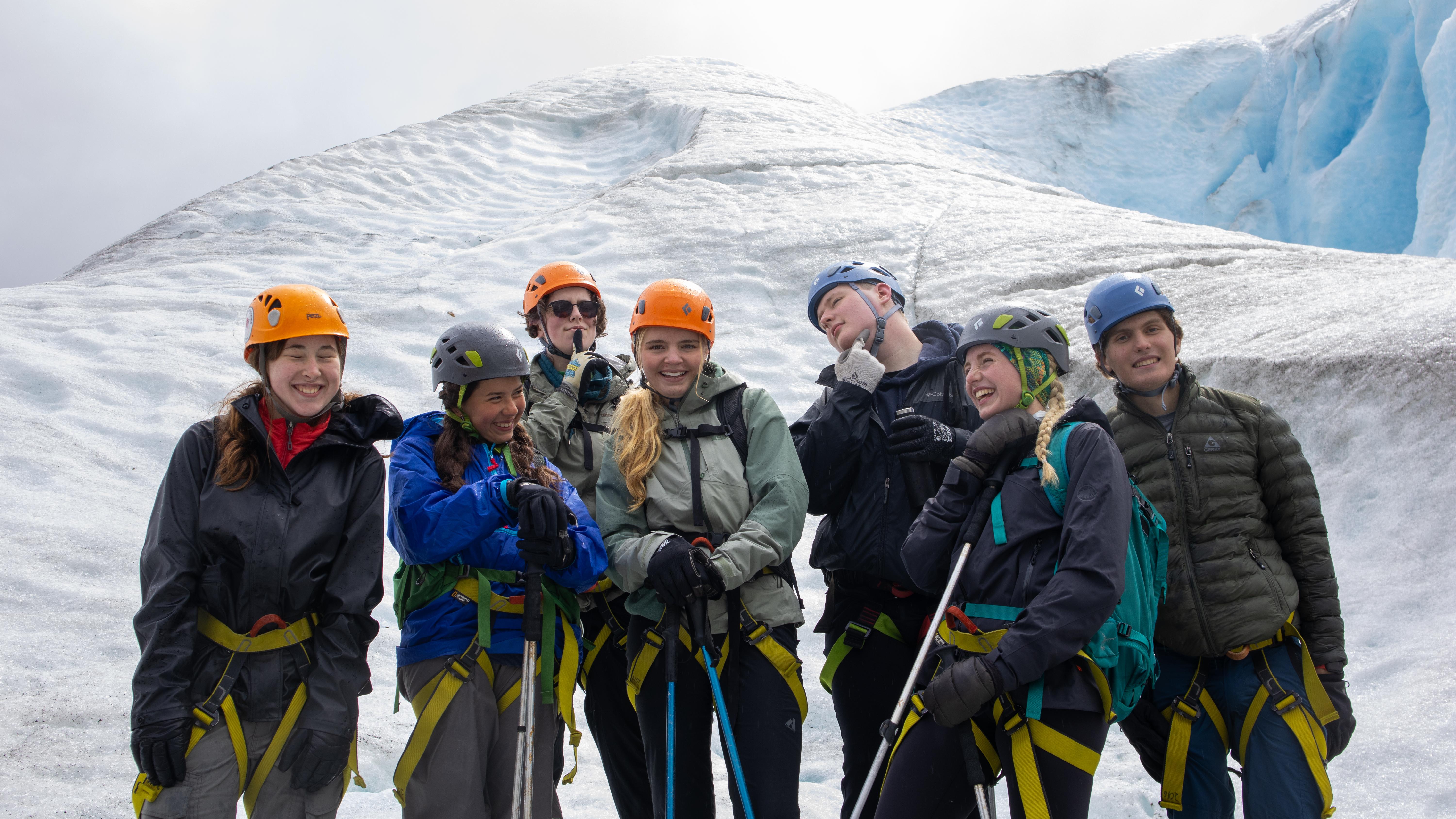 Photos of several youth in mountaineering gear posing in front of glacial ice.