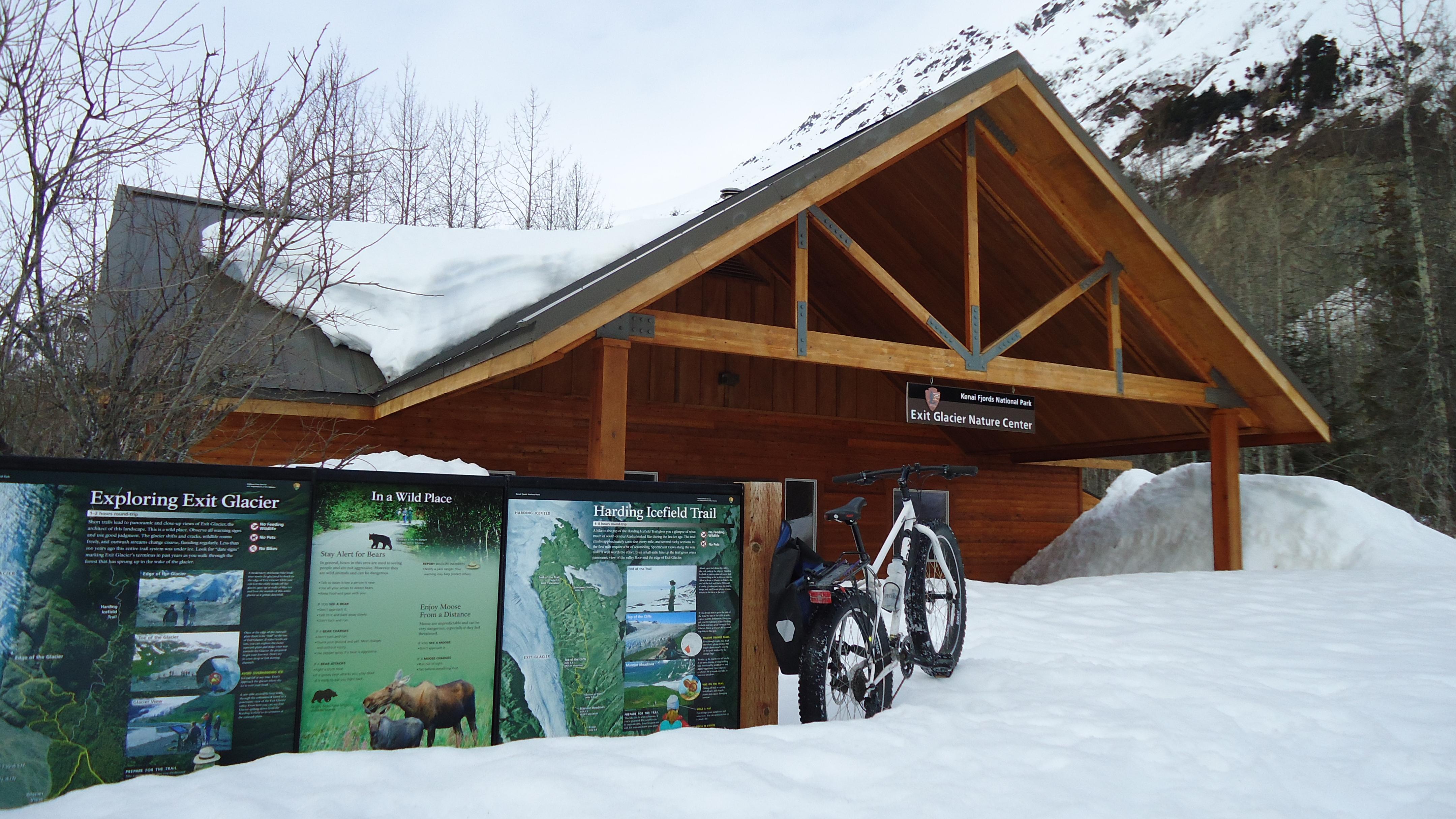 Visitor center and sign board under snow