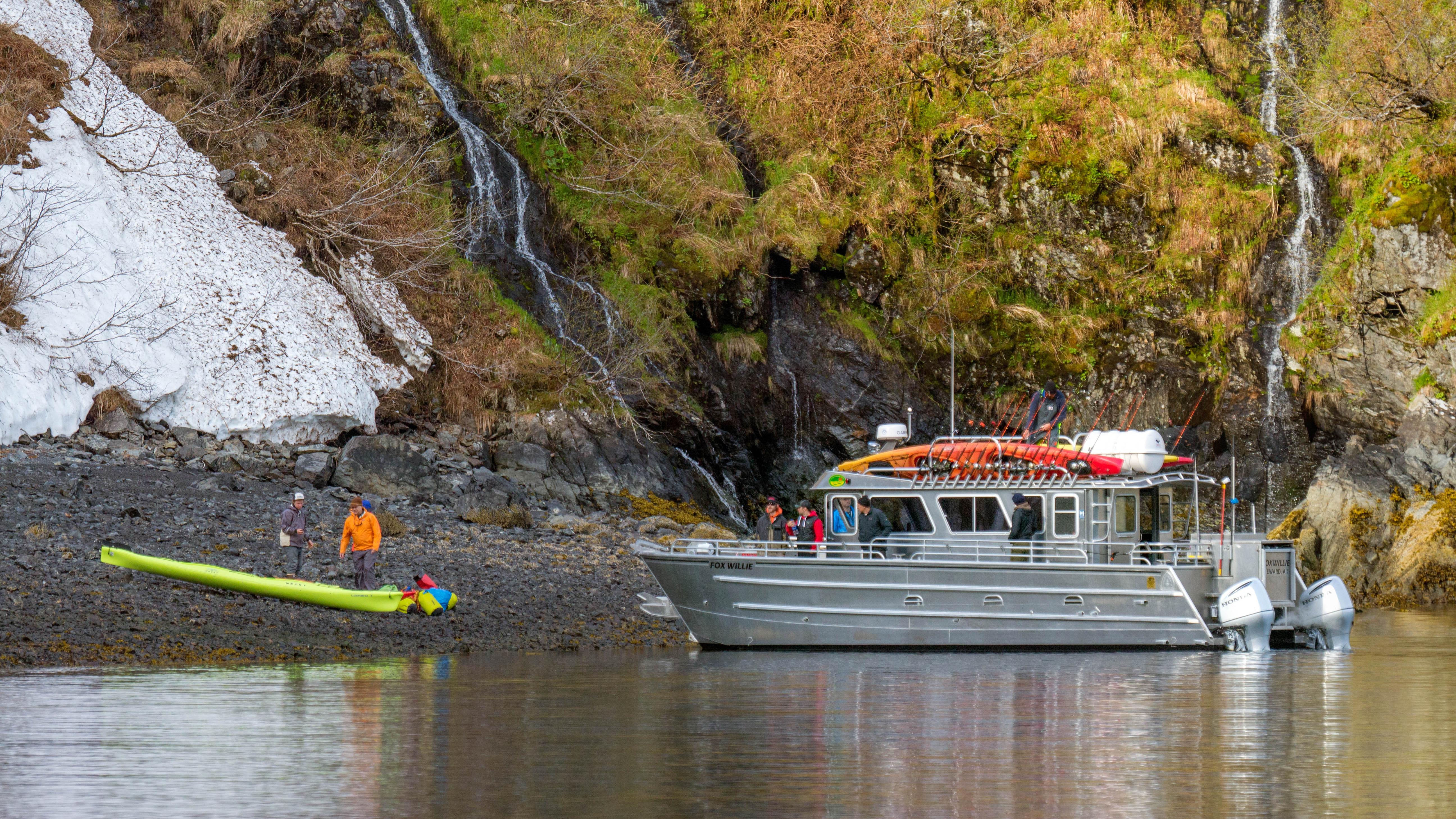 A water taxi drops off passengers onto shore