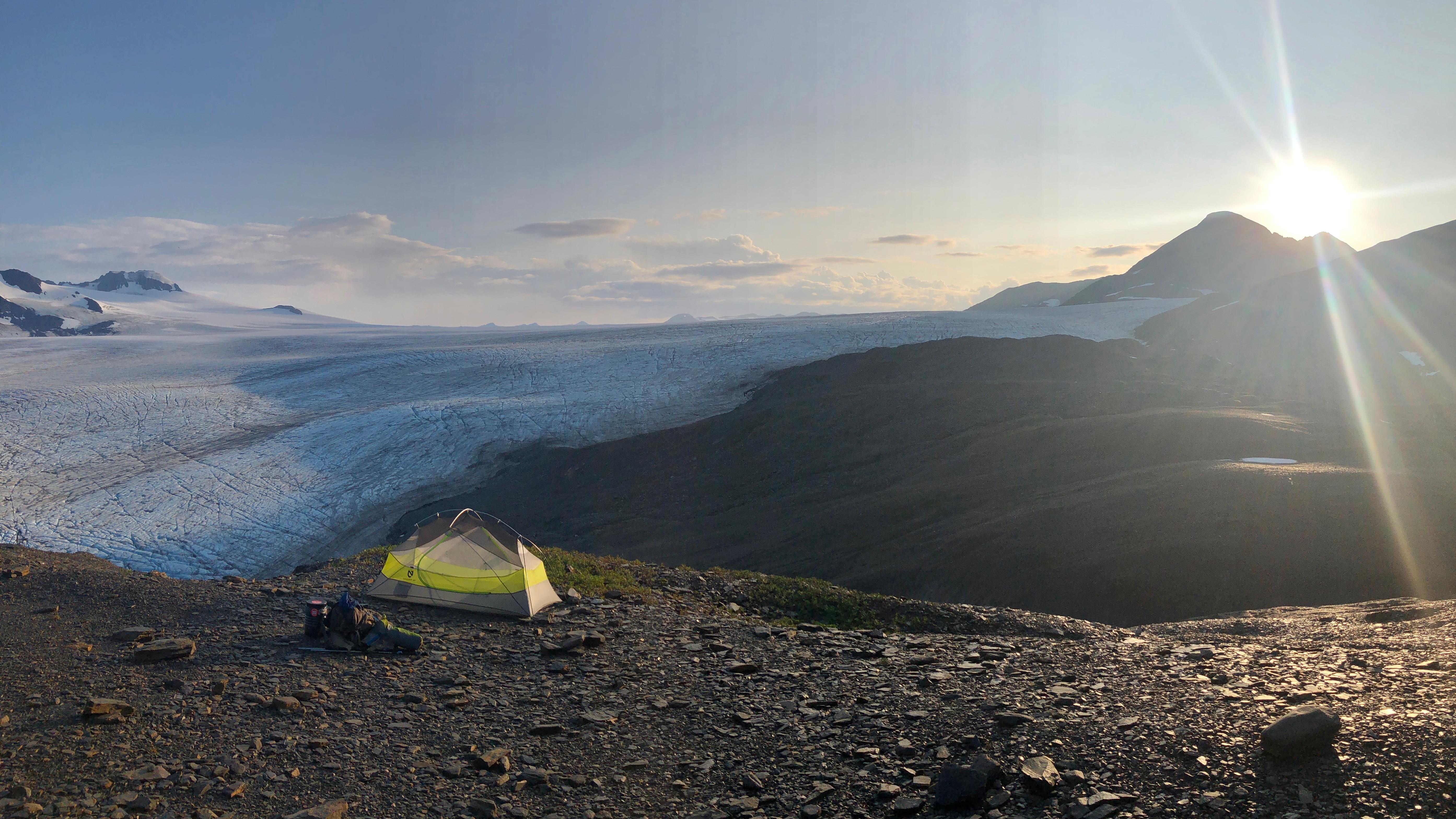 A tent with an icefield in the distance