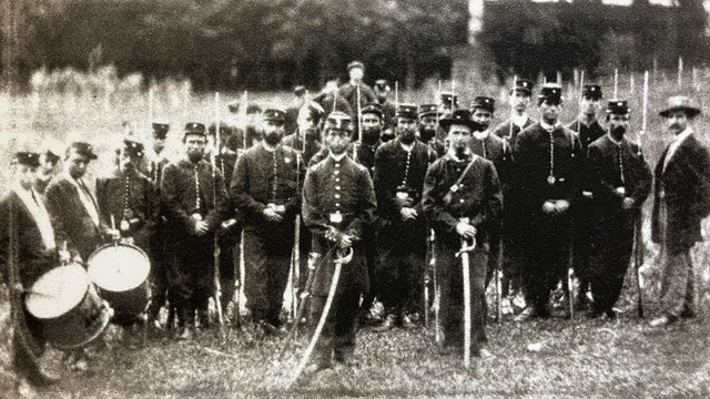 Black and white image Civil War era Union soldiers standing at attention