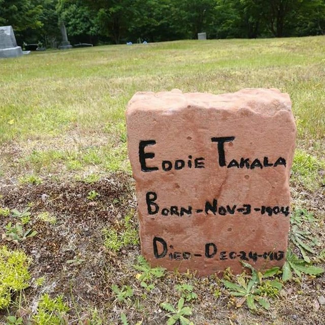 A handmade stone grave marker