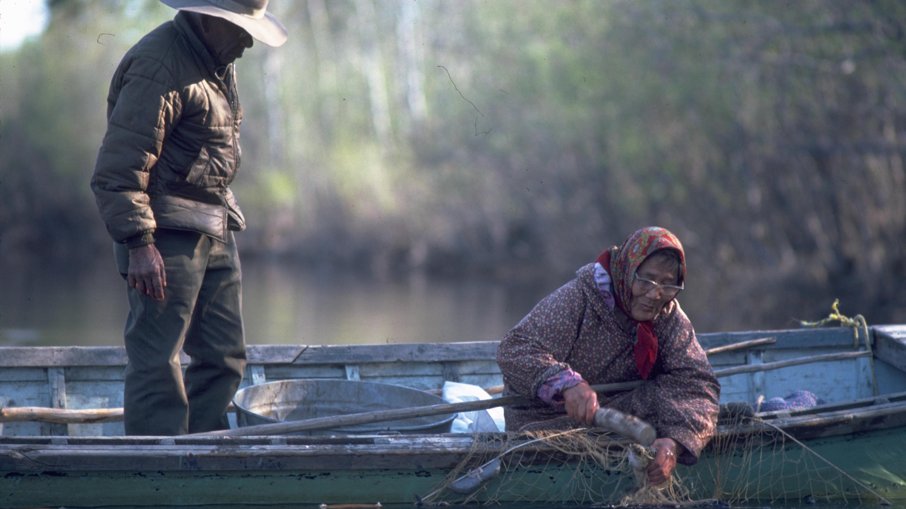 Two Inupiat Elders fishing along the river