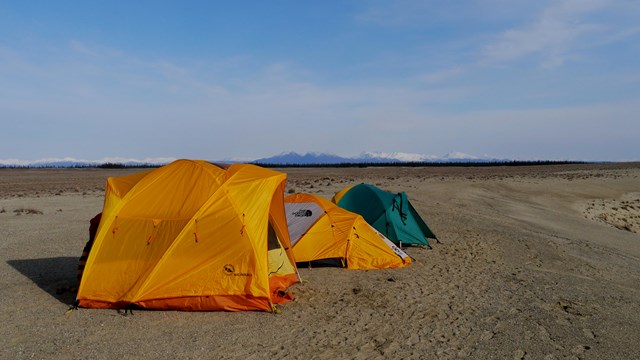 Tents stand on top of sand dunes in Kobuk Valley 