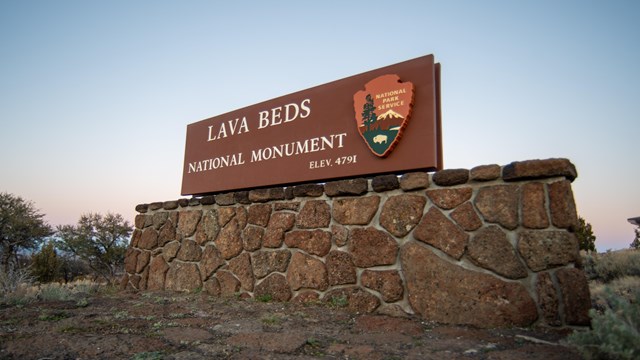 A sign that reads Lava Beds National Monument Elevation 4791 ft.