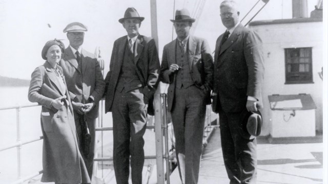 Dr. de Laguna stands with other archeologists on a steam ship