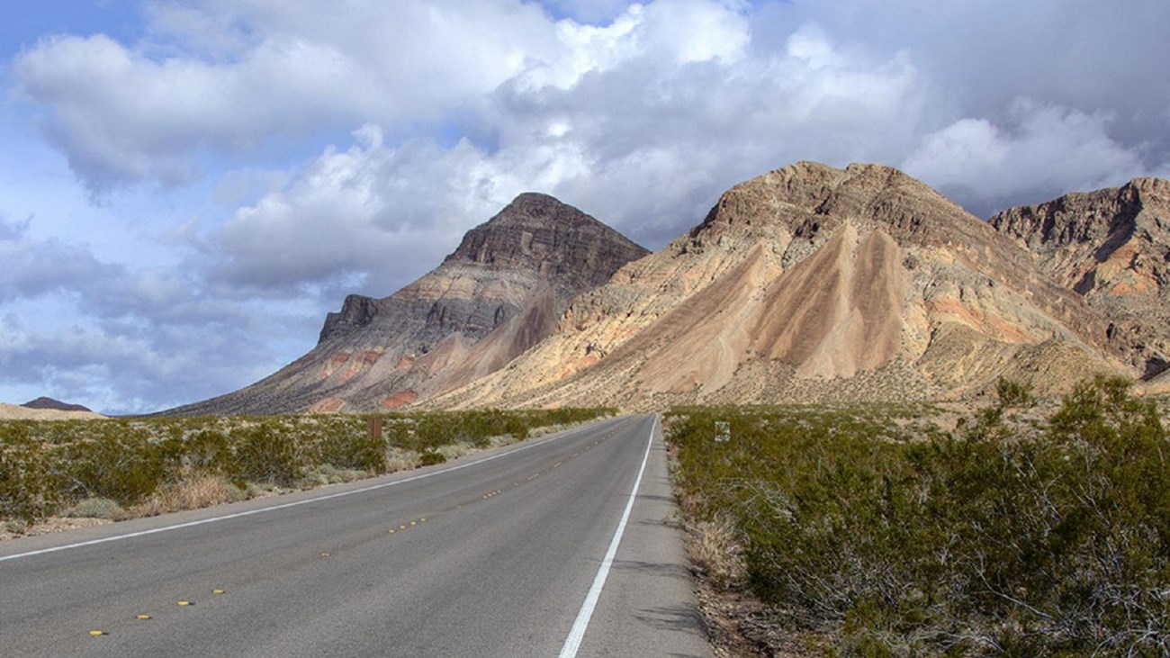 Road with view of mountains in background.