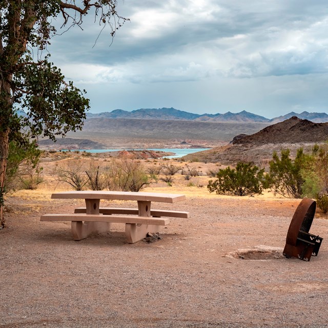 A desert campsite with Lake Mead in the background. 