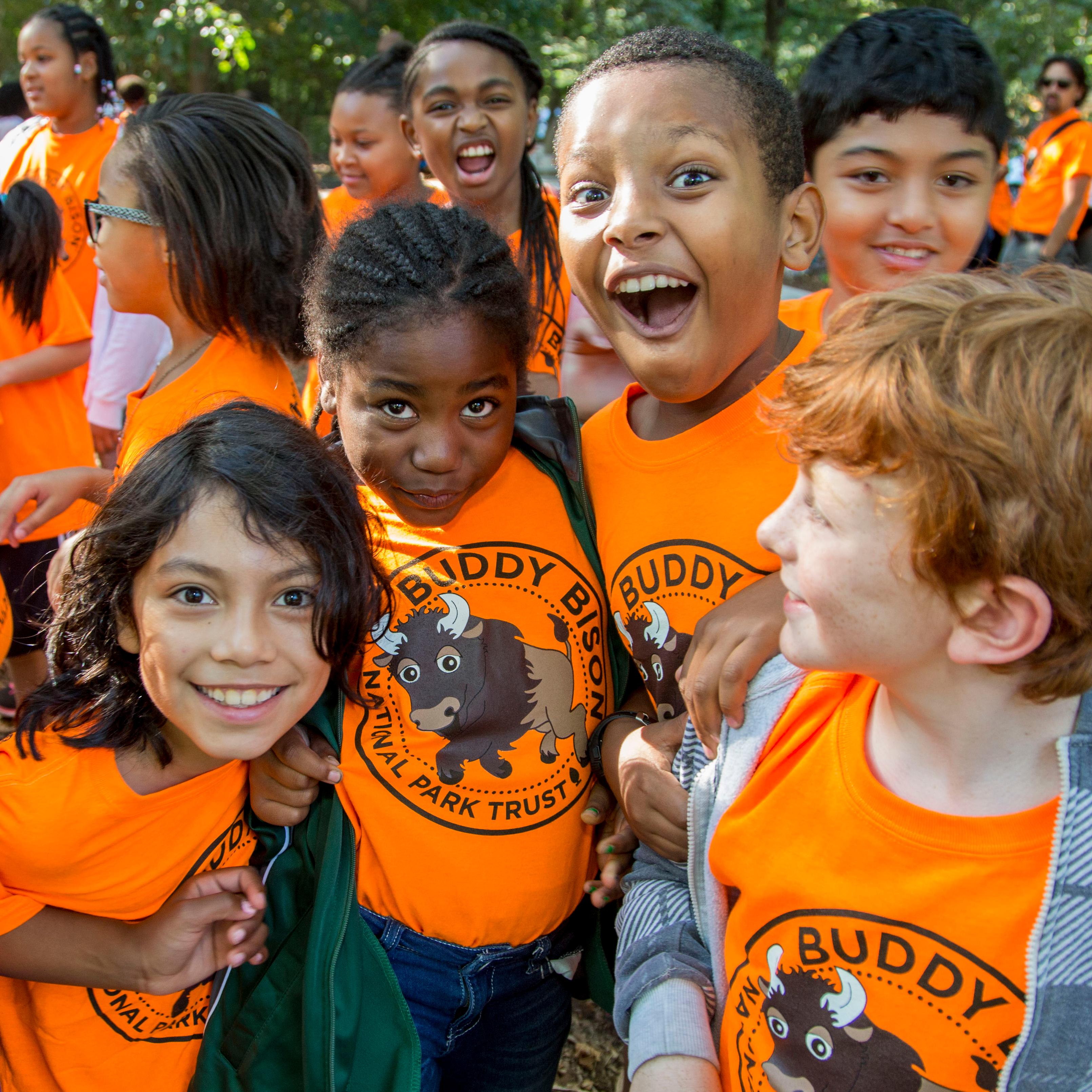 Group of kids enthusiastically posing for the camera