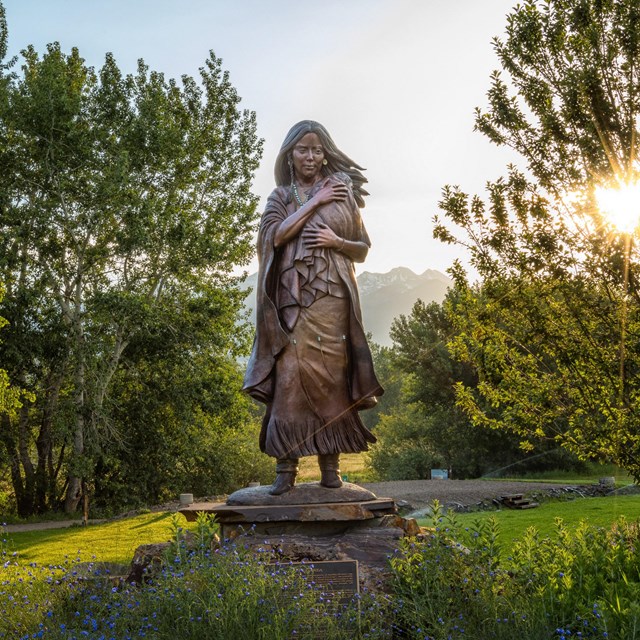 a statue of a woman holding a baby