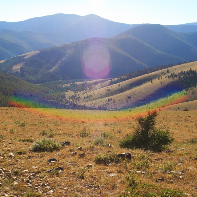 rainbow near mountains