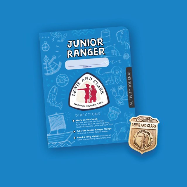 Blue activity booklet on blue background. Badge. Lewis and Clark Trail Junior Ranger
