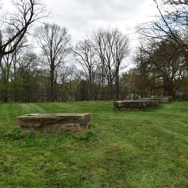  large grassy area with stone tablets