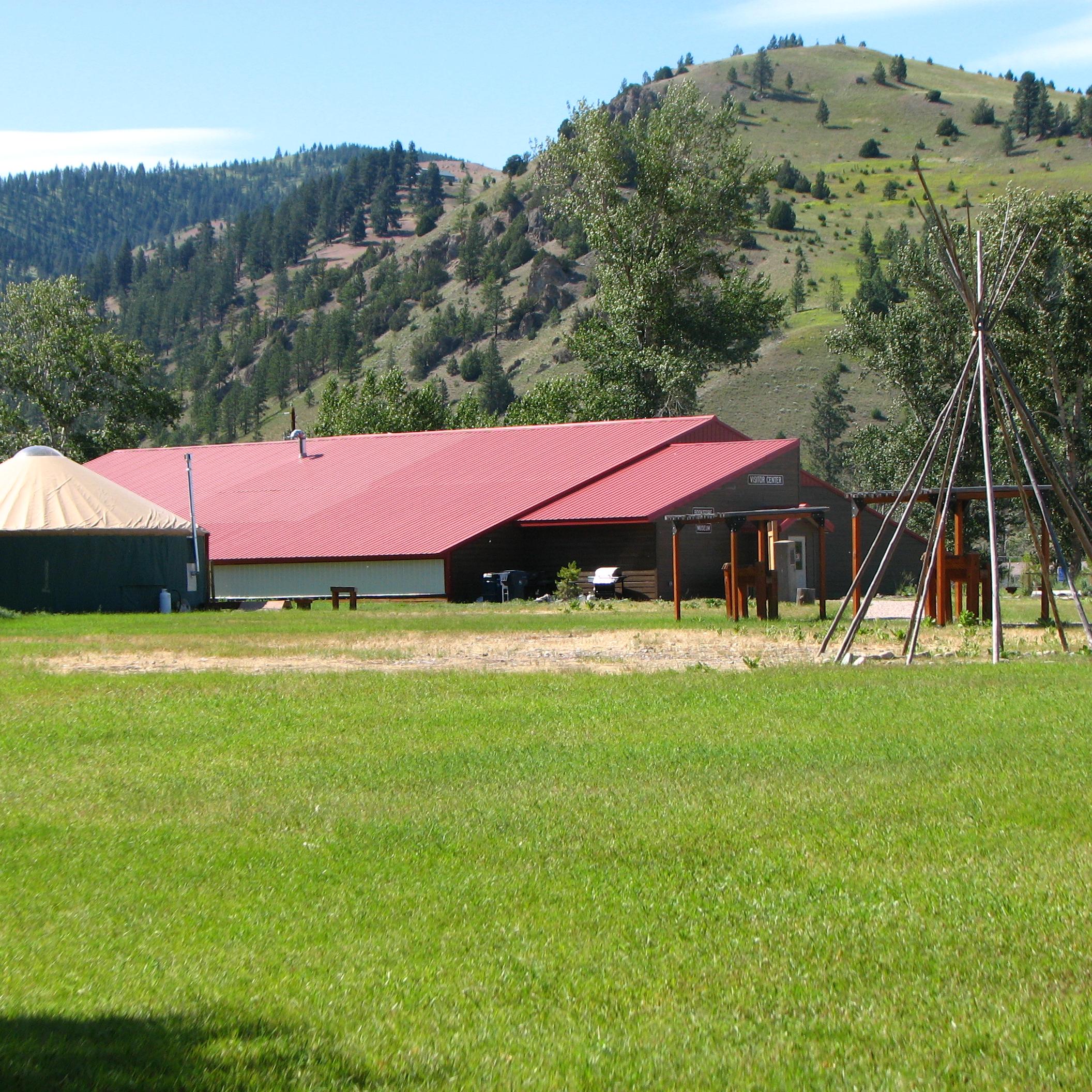 Red roof building with green grass