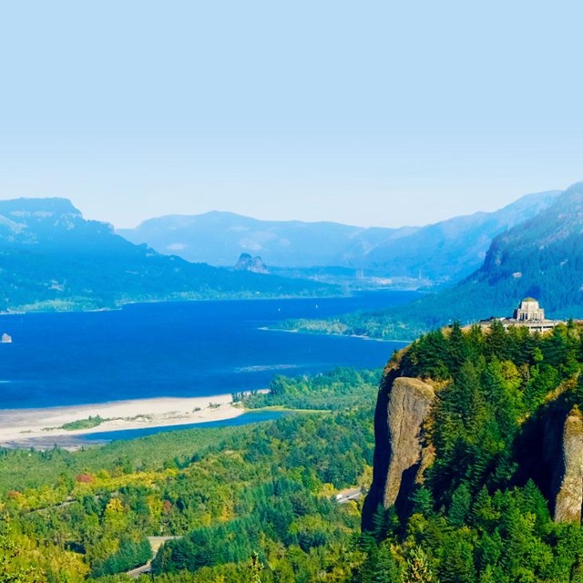Vista house perches on a cliff in an iconic view of the Columbia River Valley in OR and WA 
