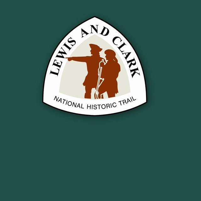 Lewis and Clark Trail logo, two explorers point West.