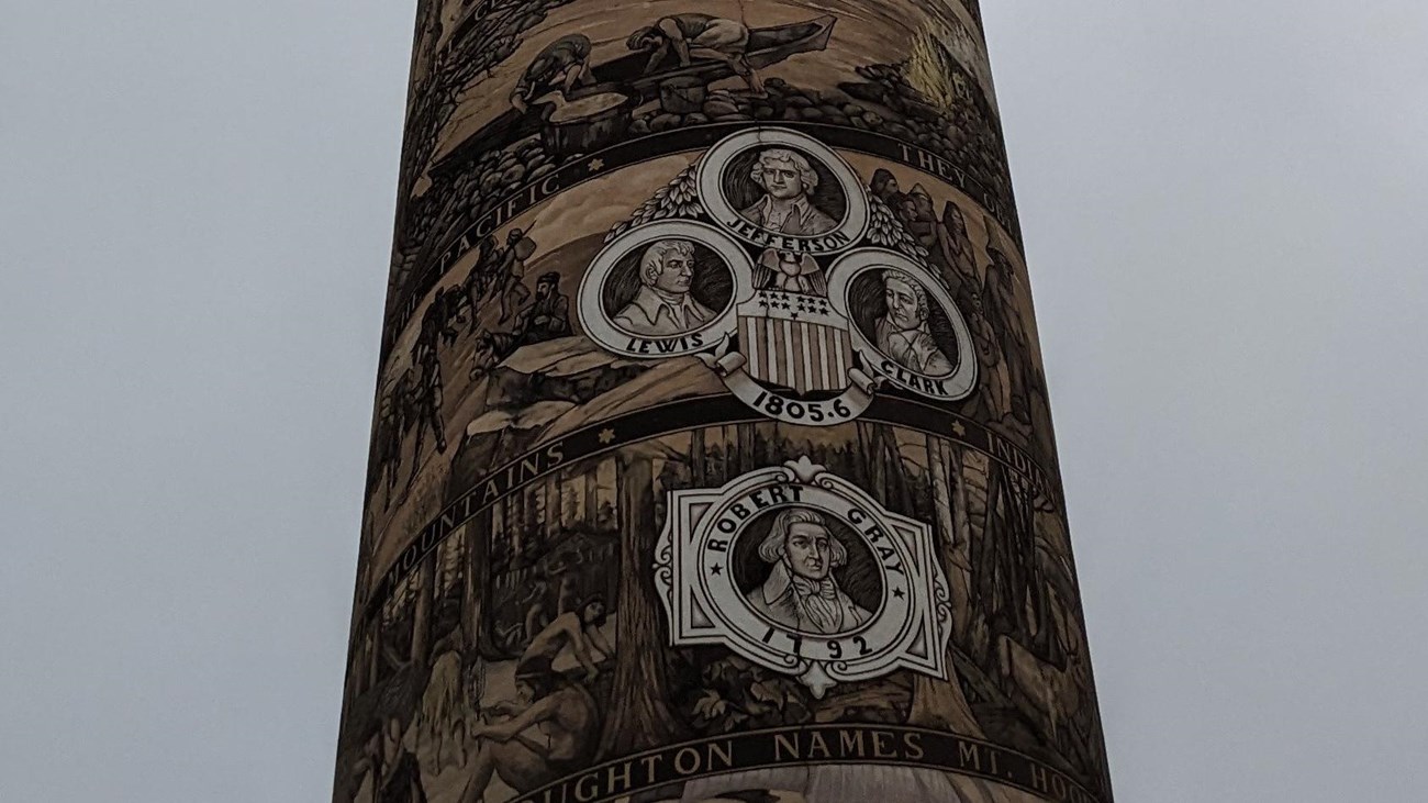 The Astoria Column from the ground looking to the top depicting the history from pre-1800 to present