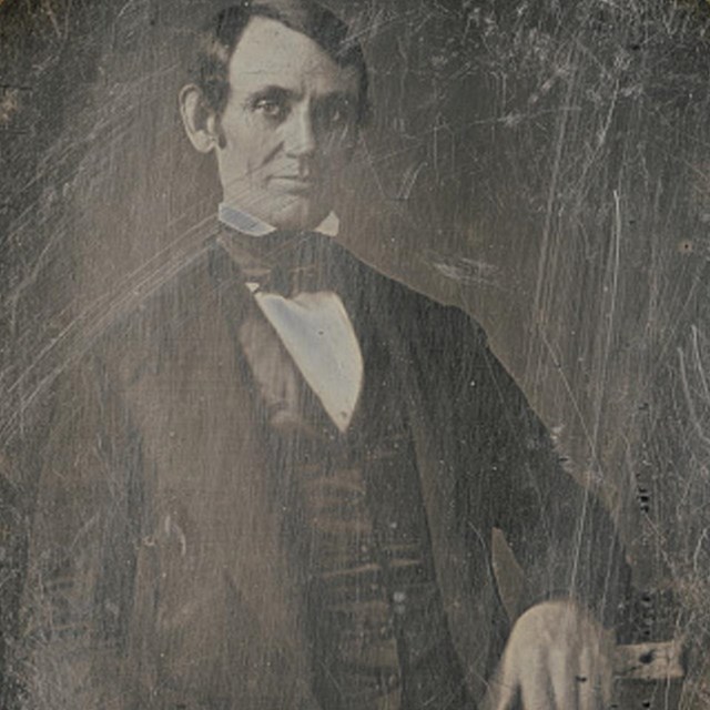 Young Lincoln as Congressman, shaven, with hair parted and slicked to right