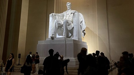Visitors around the statue of Abraham Lincoln at the Lincoln Memorial