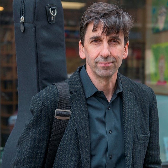 Pete Smith with guitar case