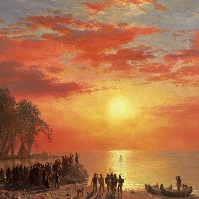 Oil painting of group of Native Americans gathered on shore of lake at sunset, canoe in distance