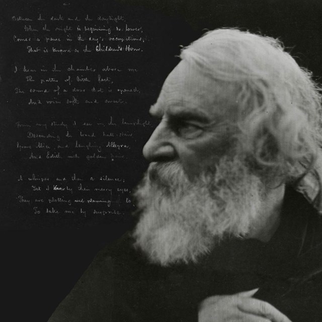 Black and white photograph of white-bearded man in profile with handwritten poetry in background