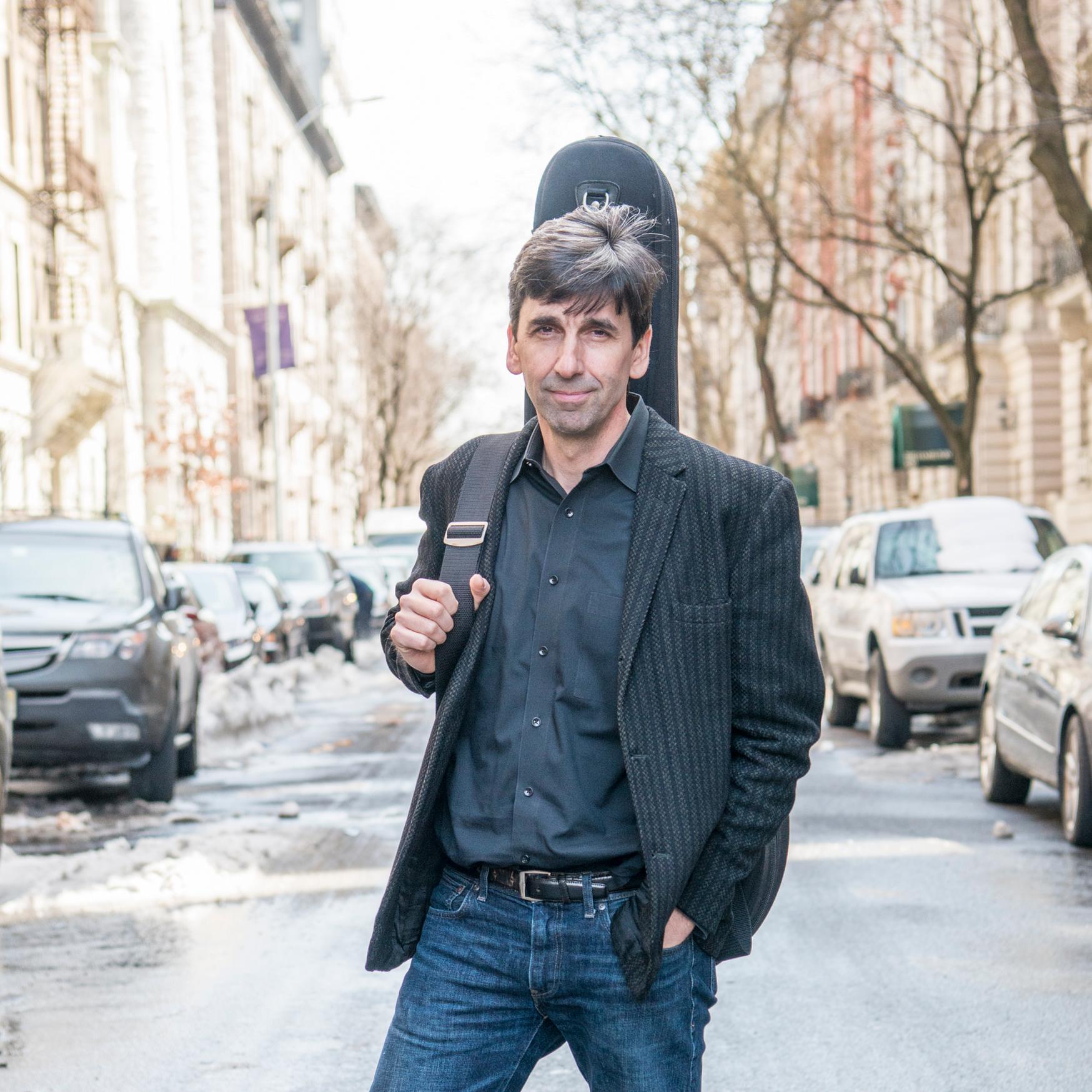 Pete Smith with guitar case