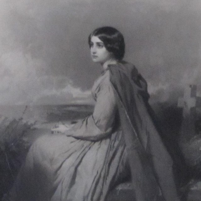 Print of young woman sitting on bench in graveyard wearing dark cloak