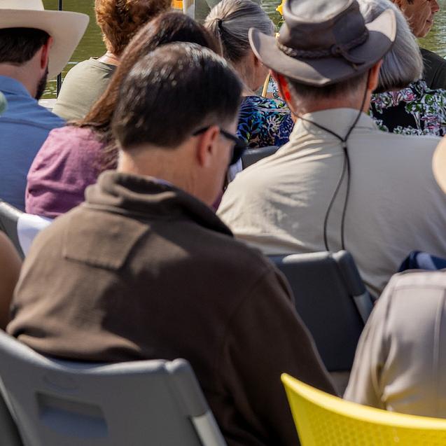 Photo of a seated group of people listening to a speaker