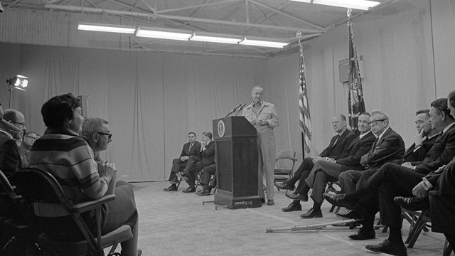Lyndon Johnson leading a press conference.