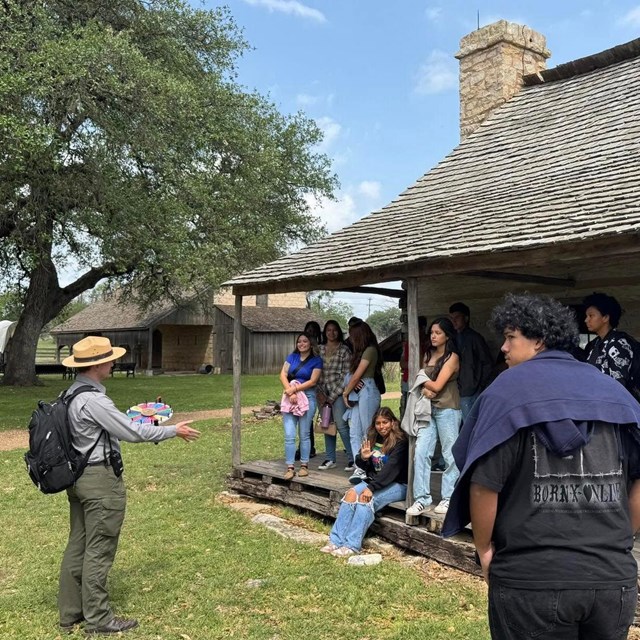 A ranger gives an education program to students. 