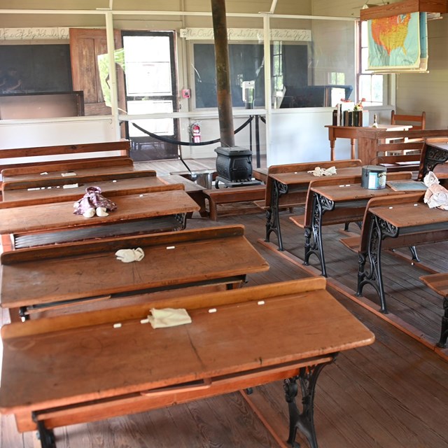 Rows of desks in a one room schoolhouse.