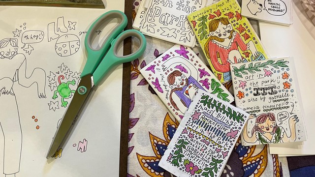 colorful hand drawn zines and scissors