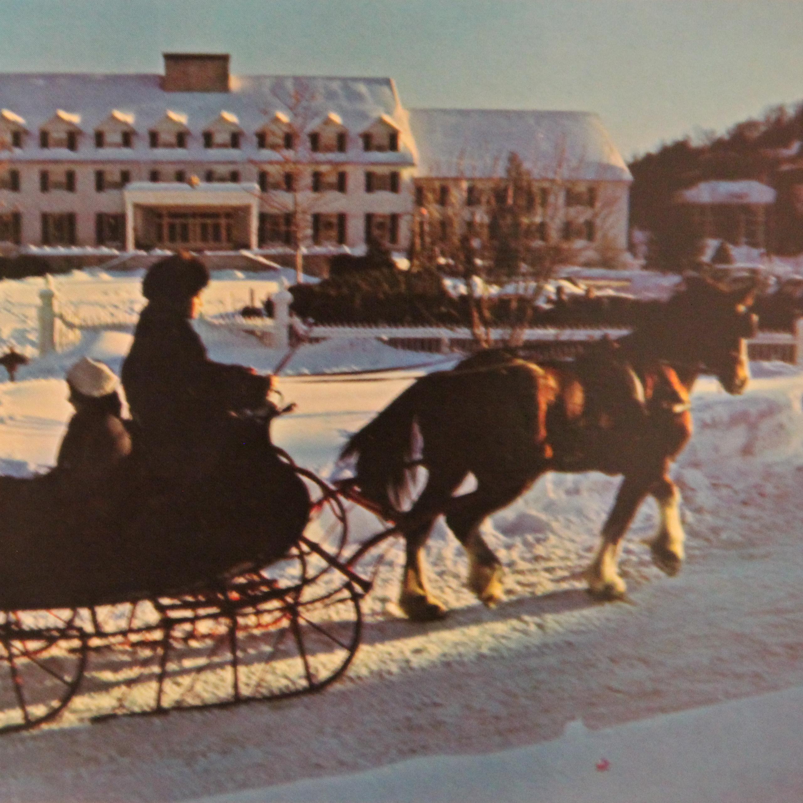 historic photo of family in a sleigh passing the woodstock inn, taken from a postcard