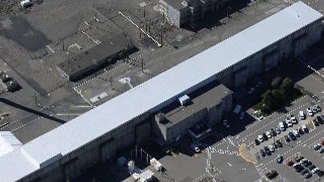 An aerial photo of a long rectangular building. 