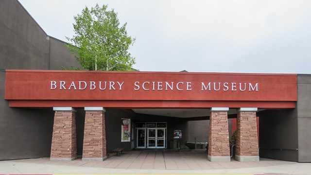 A brick building with red siding and title, "Bradbury Science Museum."