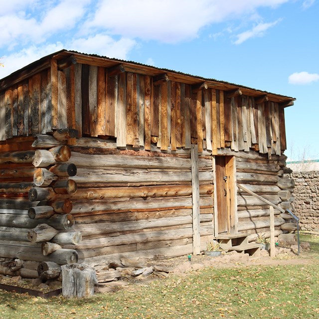 A historic, rustic wooden cabin.