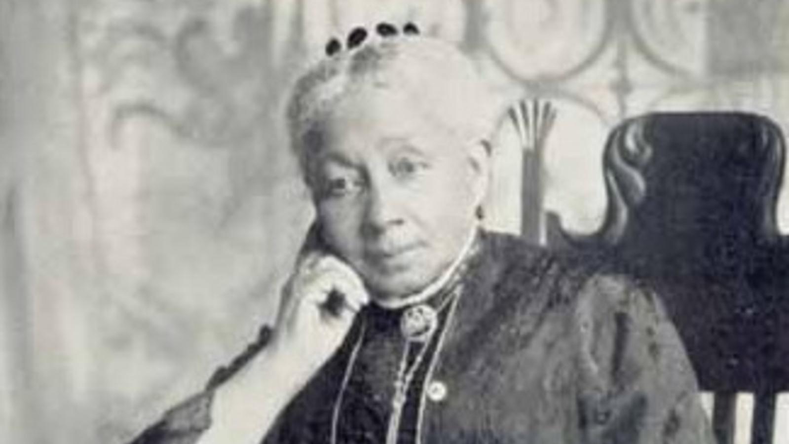 Portrait of Dr. Susan Mckinney Steward, seared in a long dress.