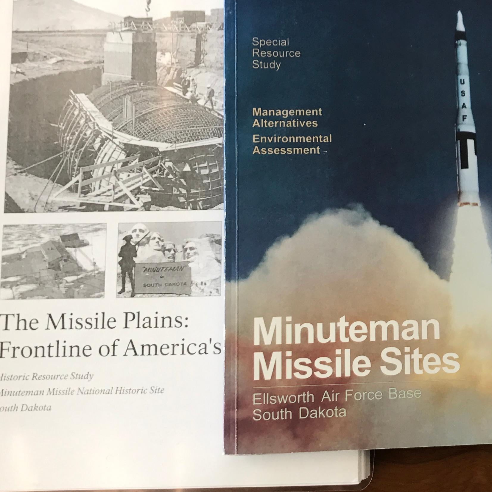Three books on a desk
