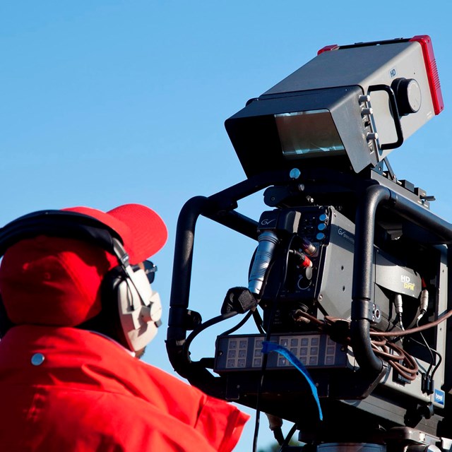 Cameraman filming with a large camera