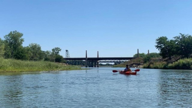 A ranger floats down the river near Green Island.  