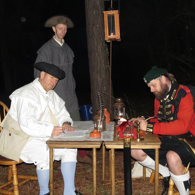 Fire burning in colonial street lamp. 