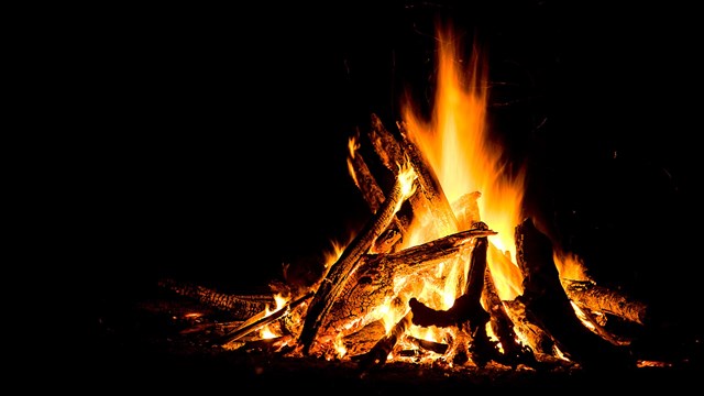 image of a campfire burning at night