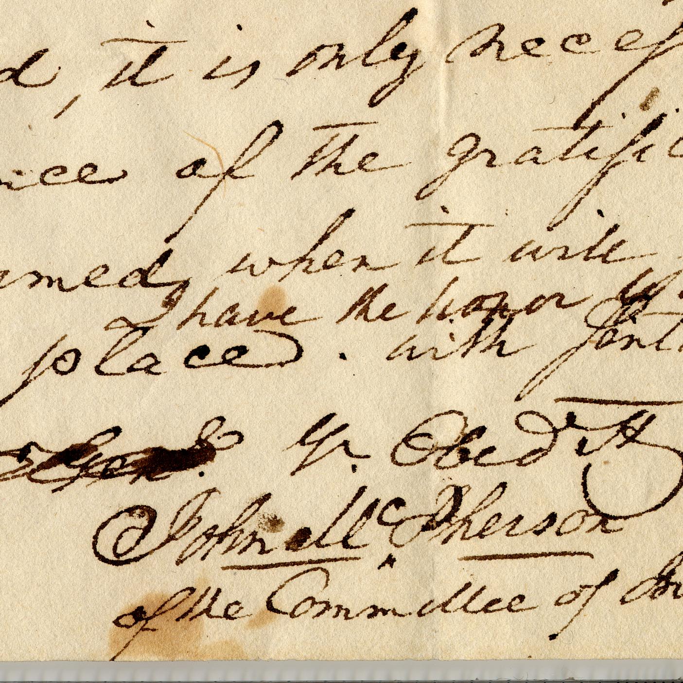 Close up of a letter written in old script with the signature of Col. John McPherson.