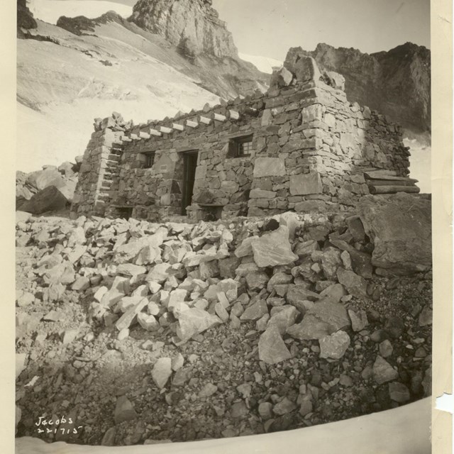 A stone building on a rocky mountainside