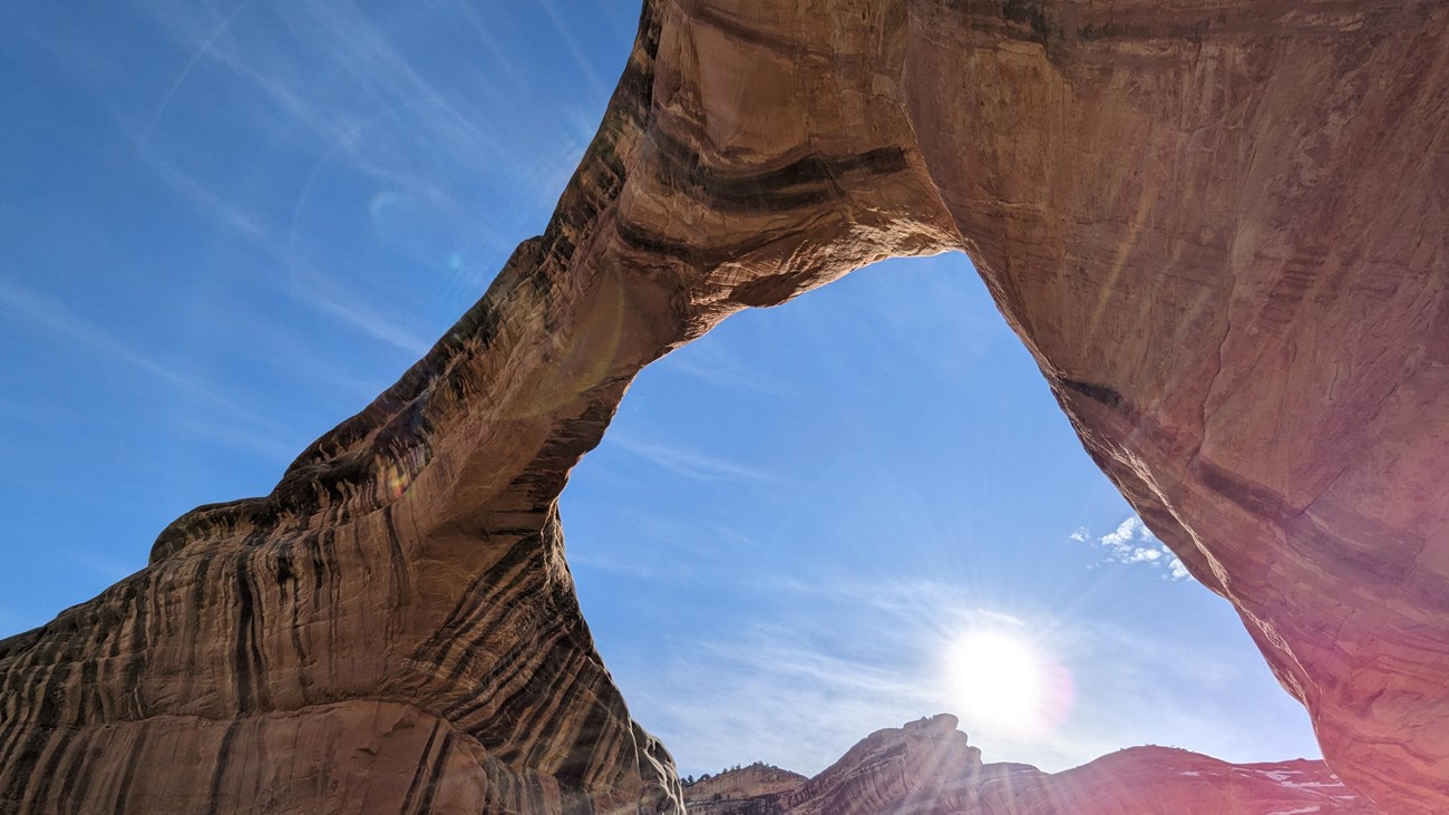 Owachomo bridge with the sun shining underneath it
