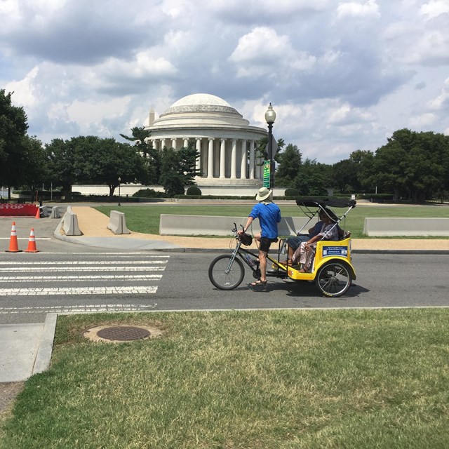 Pedicab on the road in front of the Jefferson Memorial