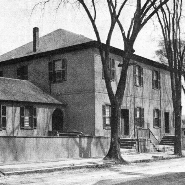 Black-and-white photo of Quaker meetinghouse on Spring Street in New Bedford.