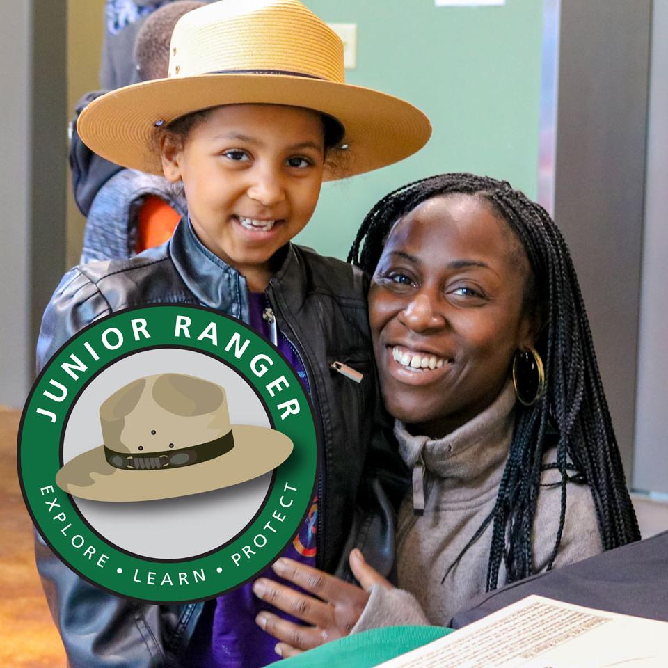 Mom and daughter smiling after becoming junior rangers